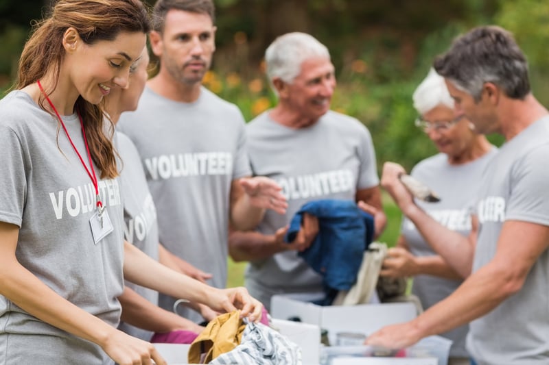 A group of people wearing tee shirts that read 
