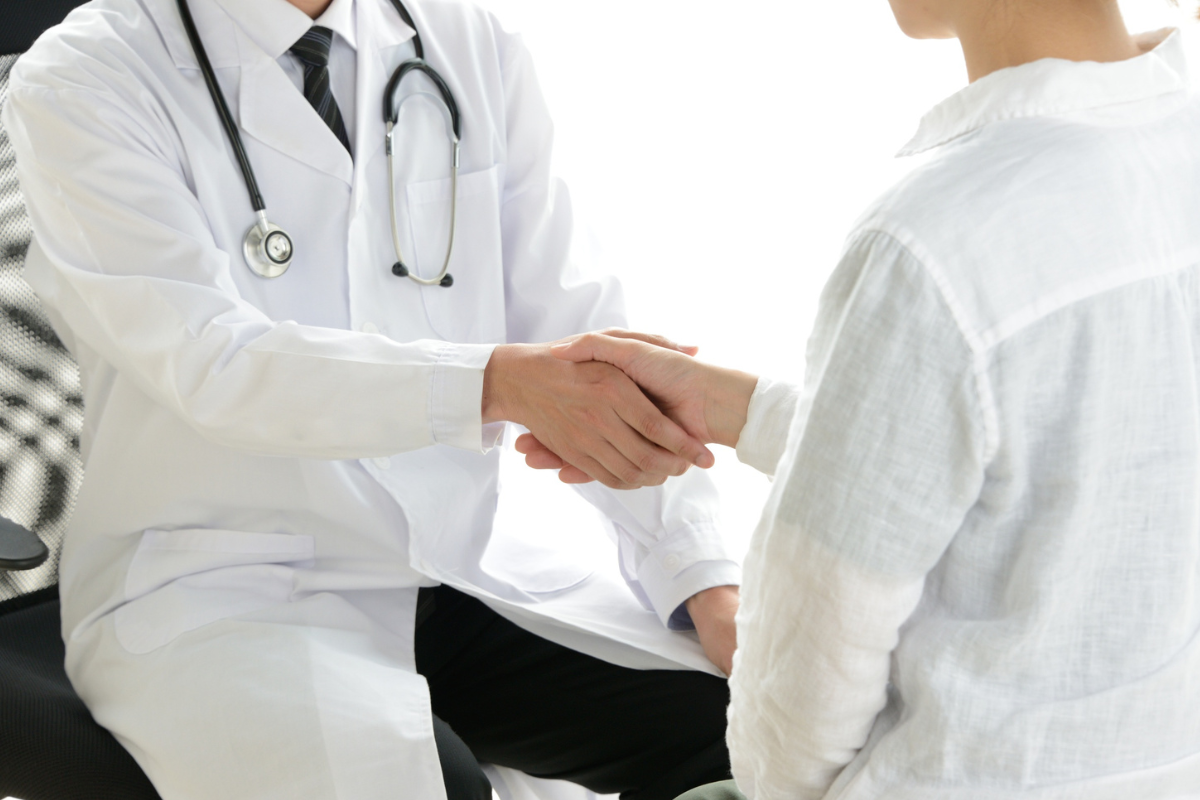 doctor shaking hands with a patient